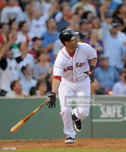 Former infielder Mike Lowell of the Boston Red Sox smiles during